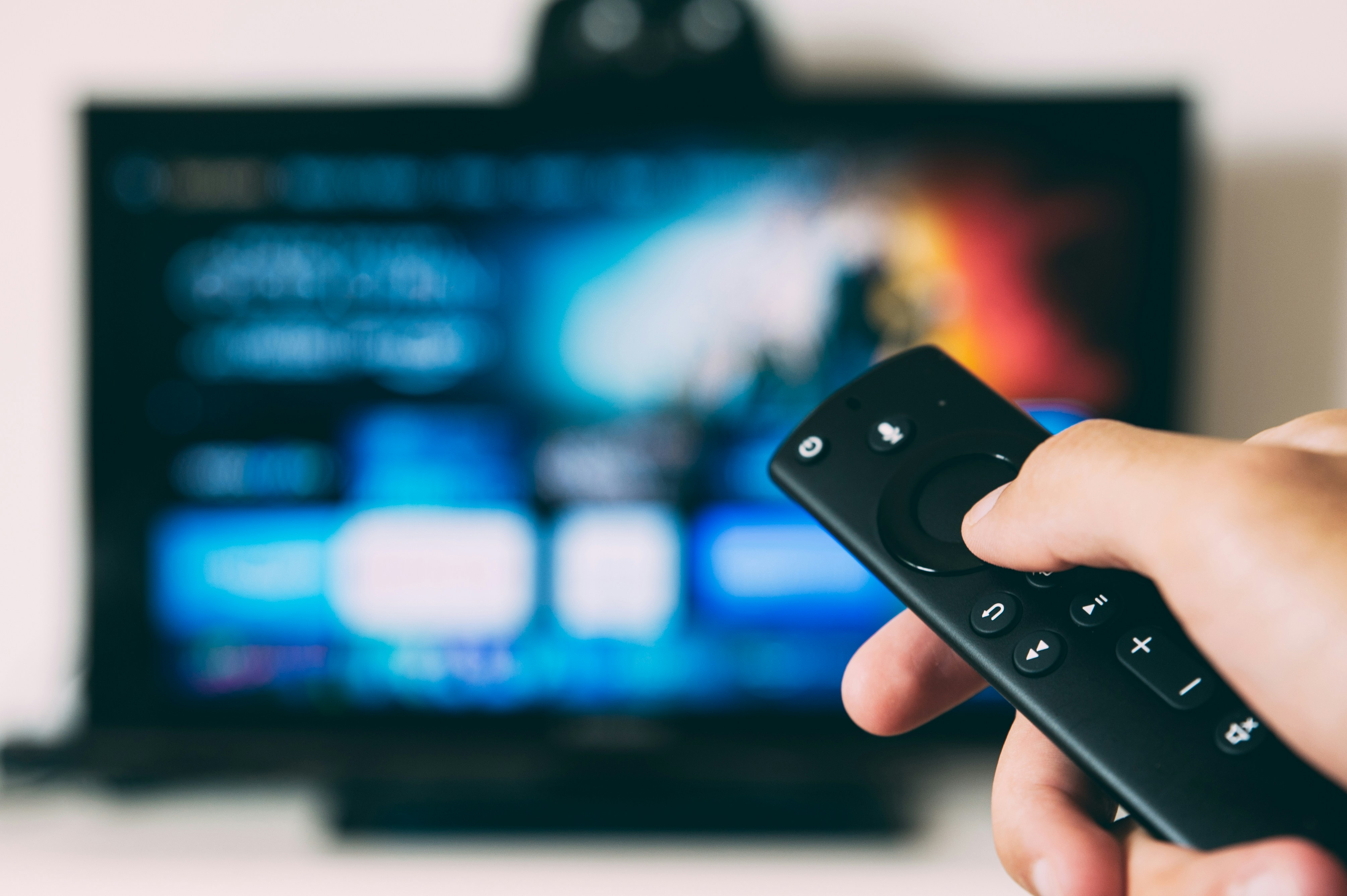 Person enjoying streaming content on a modern TV