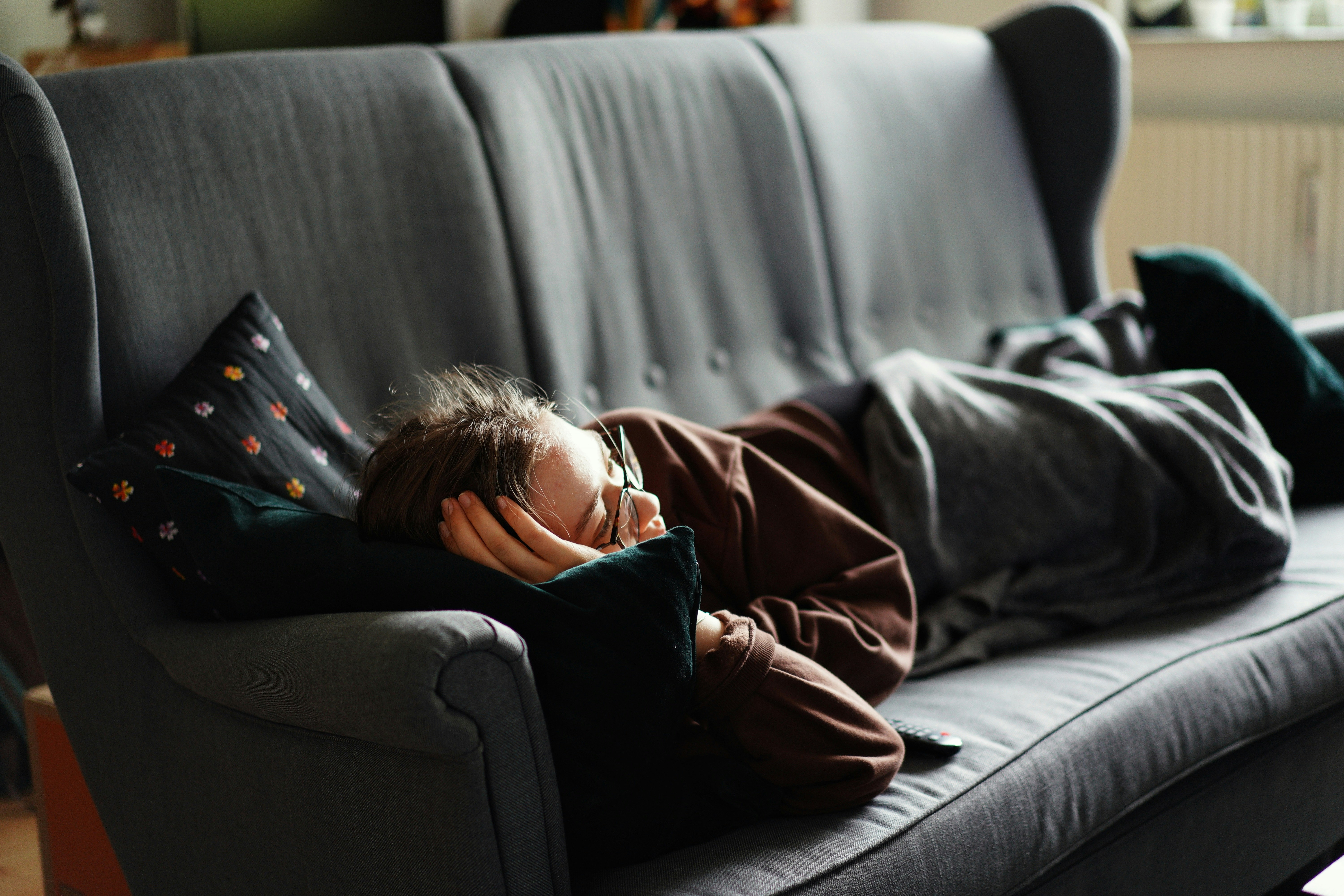Person relaxing while watching TV